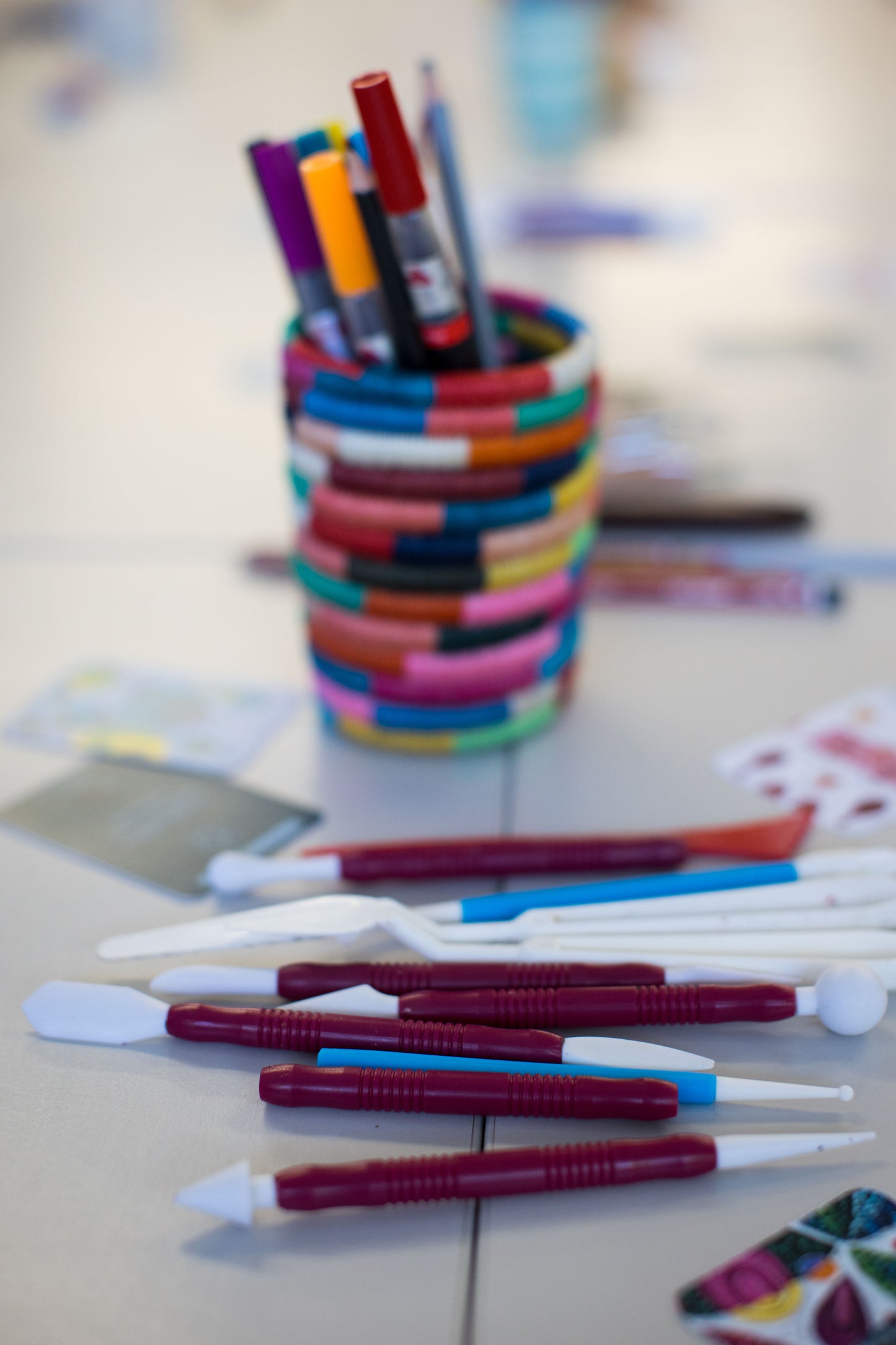 A set of modeling clay tools carefully arranged on the table, ready for participants to use at the Eclo Art Mindful Clay Art Workshop with Clay Artist Emy Oikawa, fostering creativity and artistic expression.
