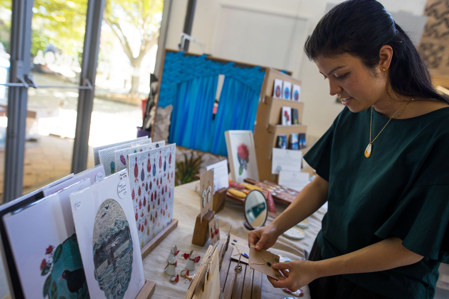 Clay Artist Emy Oikawa is setting up a private market for Mindful Clay Art Workshop participants, offering them a special opportunity to explore and purchase her unique clay creations. The display showcases Emy’s artistic journey, inspiring others through her handcrafted pieces.