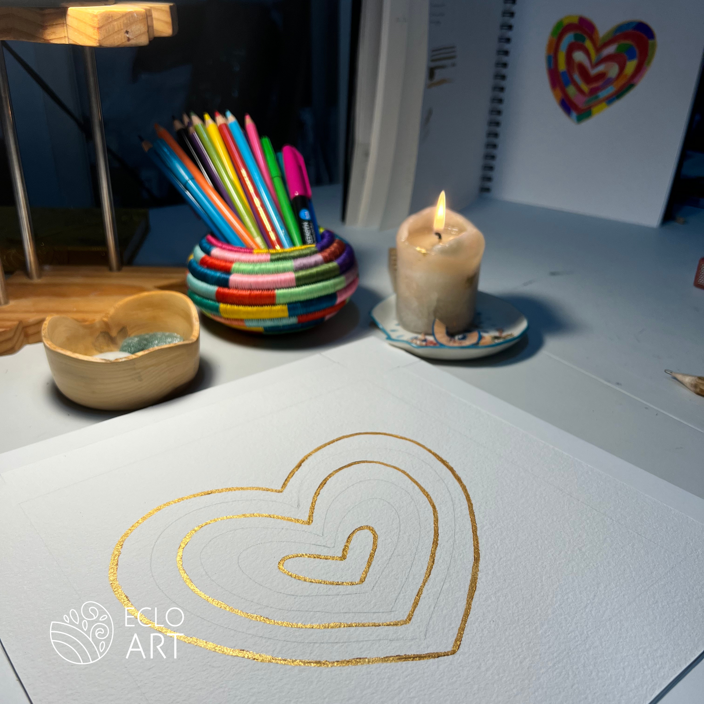 Golden acrylic paint in heart shape for the I LOVE ME art piece by clay artist Emy Oikawa from Eclo Art