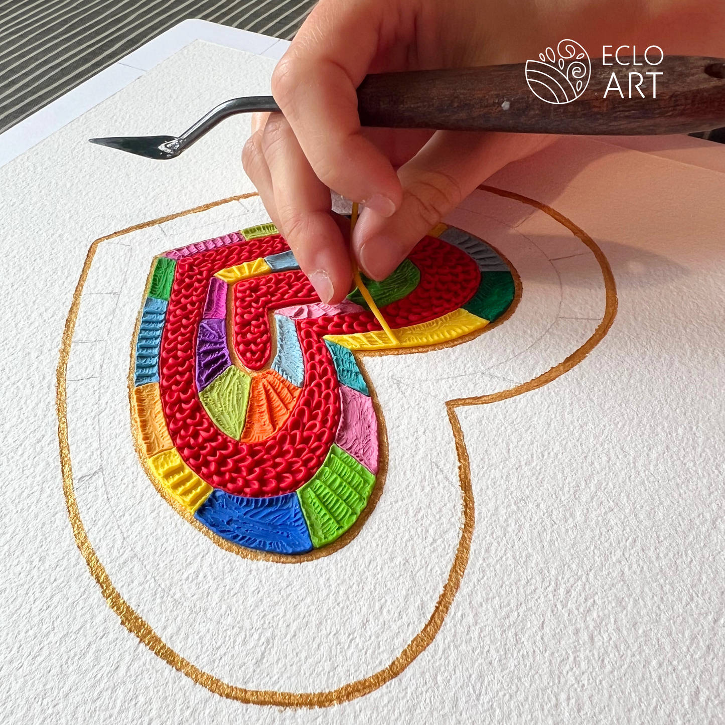 placing each little piece of clay on the board, a work of love here in wellington new zealand by clay artist Emy Oikawa from Eclo Art