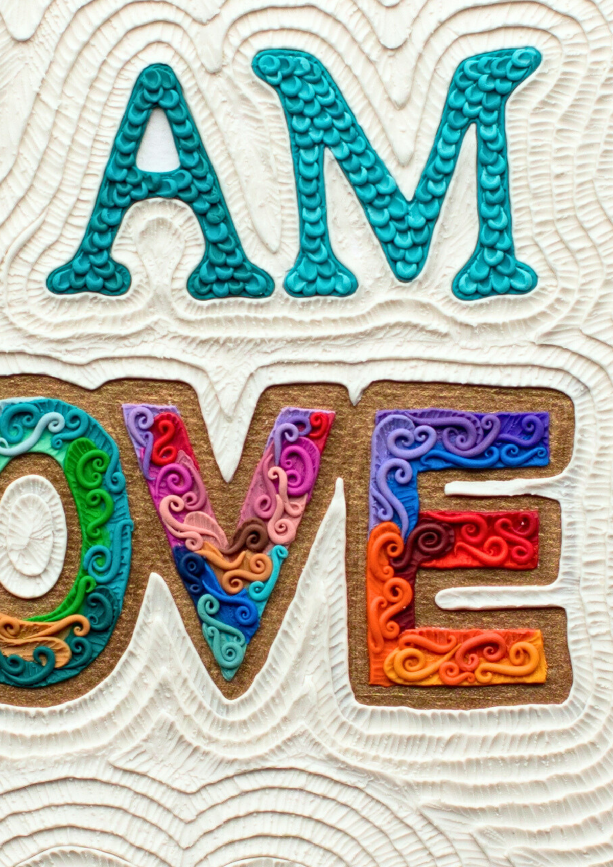 A close up of I AM LOVE, A3 Affirmation Plasticine clay art print by New Zealand artist Emy Oikawa from Eclo Art