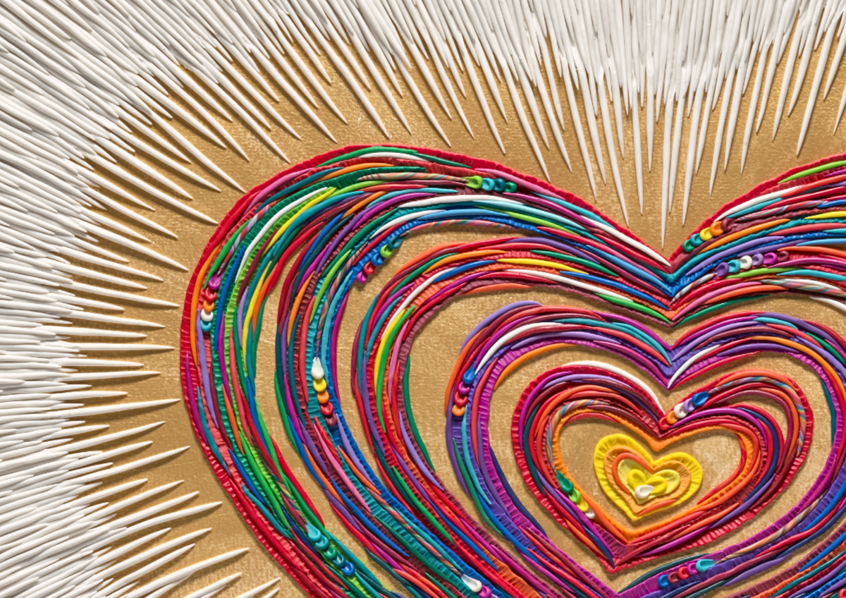 A close-up of a heart-shaped layered art piece, originally made from colorful plasticine, arranged on a gold acrylic paint background with white plasticine lines radiating outward. Art many by Emy Oikawa, from Eclo art.