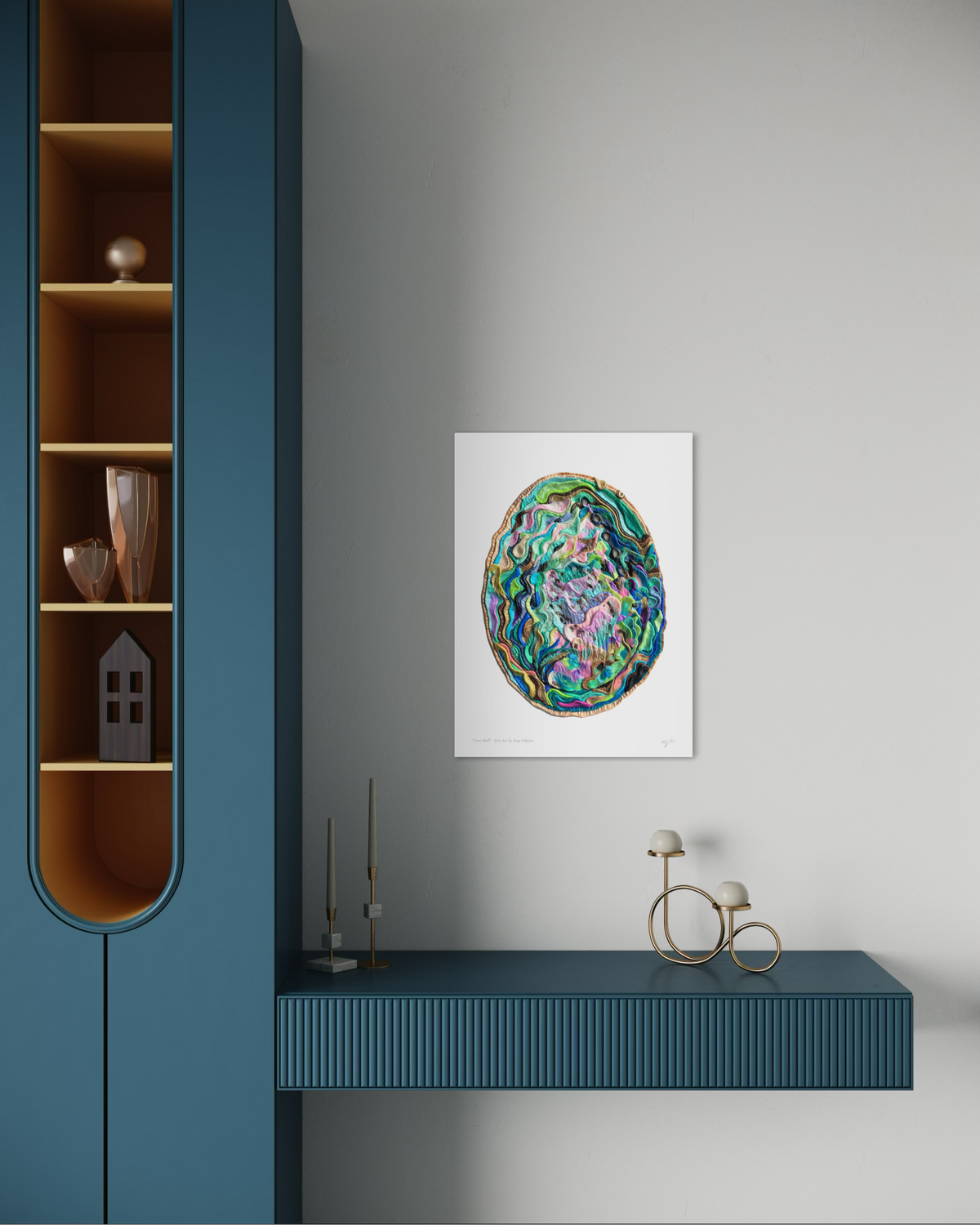 An A3 Paua Shell art print featured and hanging on a light gray wall in a modern interior setting with a blue console table and shelving. New Zealand Art by Emy Oikawa.