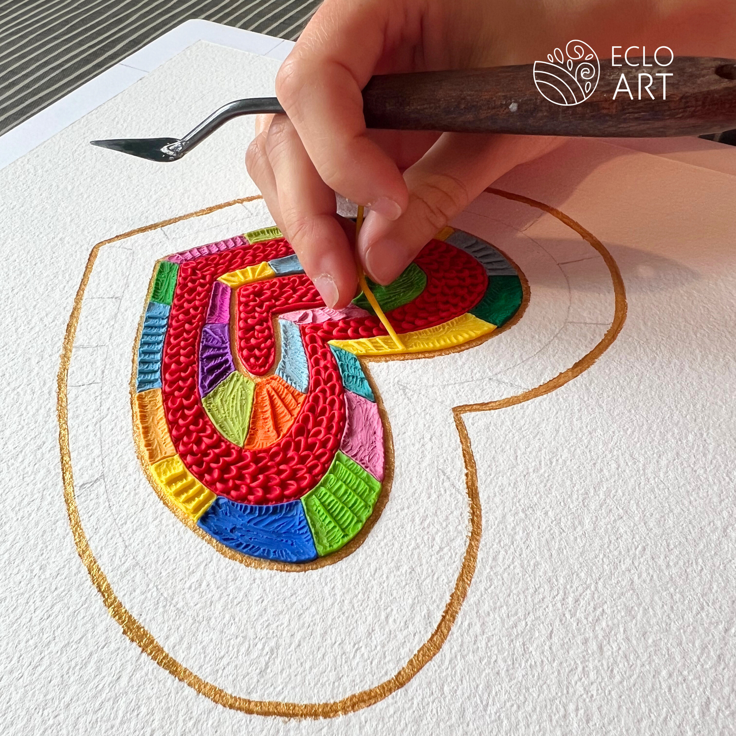 placing each little piece of clay on the board, a work of love here in wellington new zealand  by clay artist Emy Oikawa from Eclo Art